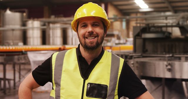 Smiling Factory Worker Wearing Yellow Hard Hat and Safety Vest - Download Free Stock Images Pikwizard.com