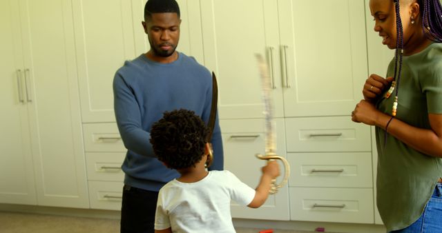 Family Playing with Toy Swords in Living Room - Download Free Stock Images Pikwizard.com