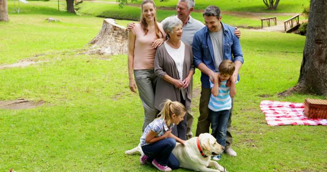 Happy Multigenerational Family Enjoying Picnic in Park with Dog - Download Free Stock Images Pikwizard.com