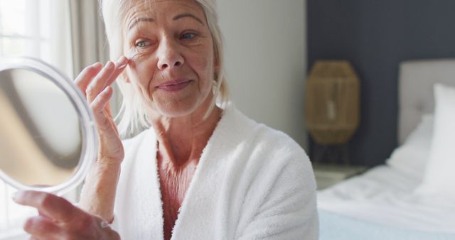 Mature Woman Applying Eye Cream in Morning Routine - Download Free Stock Images Pikwizard.com