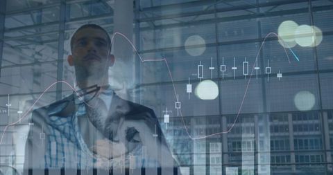 Businessman conceptualizing finance strategy amid graphs