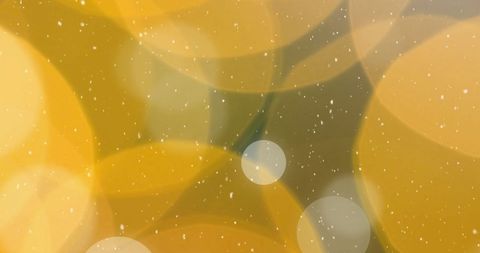 Christmas Snowfall Over Orange Festive Lights Background