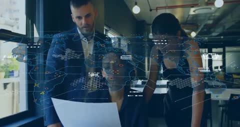 Colleagues Collaborating in Modern Tech Office with Digital World Map