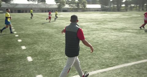 Soccer players engaging in practice on field for team training