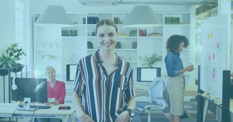 Confident businesswoman with diverse team in modern office setting