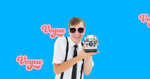 Young photographer embracing retro style