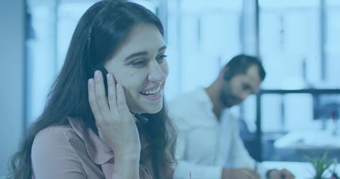 Customer Service Representatives Assisting Clients at Office