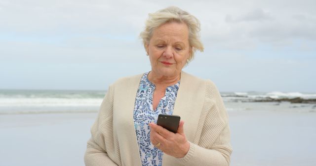 Senior Ombre Using Smartphone on Beach - Download Free Stock Images Pikwizard.com