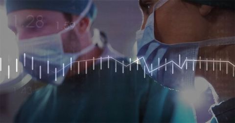 Surgeons analyzing vital signs with digital overlay in operating room