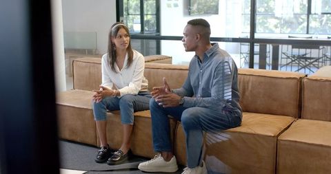 Business Colleagues Engaged in Discussion in Modern Office