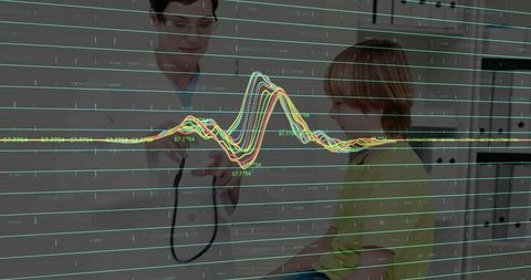 Pediatric doctor placing stethoscope on child with overlaid vital signs and monitor data