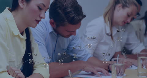 Students Solving Math Equations Using Computers in Classroom