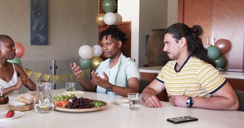 Friends Enjoying Snacks at Home Celebration Gathering