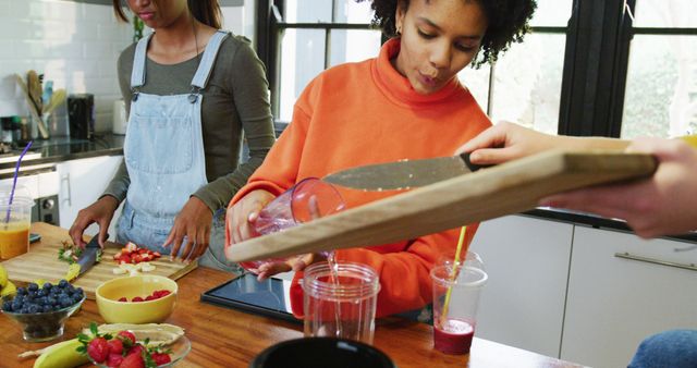 Two Girls Enjoying Healthy Morning Smoothie Preparation - Download Free Stock Images Pikwizard.com