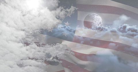 American Flag Waving Beneath a Moonlit Sky with Clouds and Stars