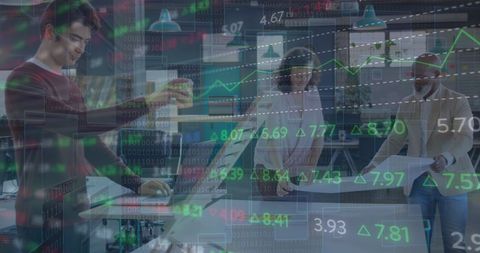 Business team analyzing financial data in modern office setting