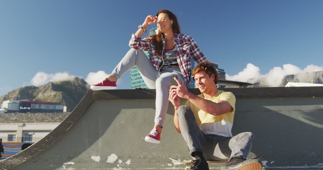 Young Friends Hanging Out on Rooftop Playfully Enjoying Sunny Day - Download Free Stock Images Pikwizard.com