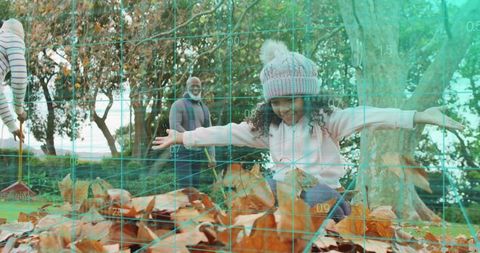 Child jumping into leaf pile with grandfather raking in park during autumn family playtime