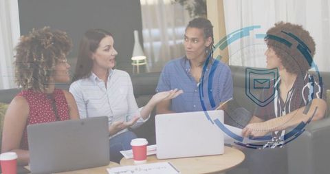 Diverse team brainstorming in modern office lounge