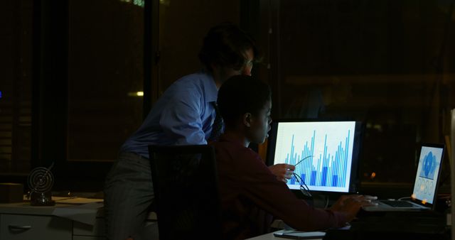 Business Professionals Analyzing Data on Computer at Night in Office - Download Free Stock Images Pikwizard.com