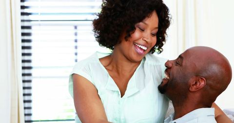 Laughing Couple Sharing Joyful Moment Indoors
