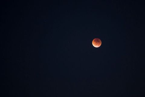 Lunar eclipse on clear night sky