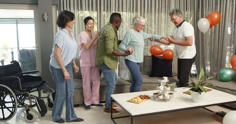 Healthcare Team Supporting New Patient in Rehabilitation Center