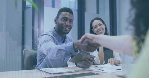 Businessman shaking hands in modern office negotiation