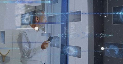 Senior man using smartphone and monitoring augmented reality business data panels