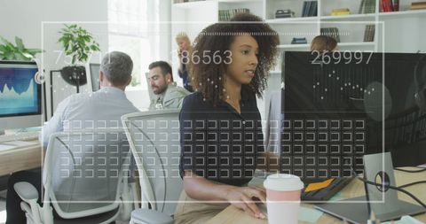 Businesswoman in Tech Office with Futuristic Displays