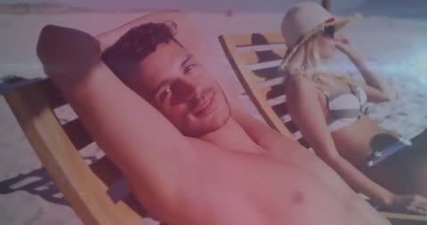 Couple Relaxing on Beach Chairs by Ocean on Sizzling Summer Day
