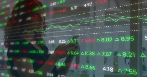 Businesswoman Analyzing Financial Data Overlaid on Charts