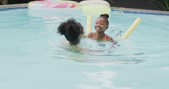 Mother and Child Enjoying Fun Swim in Pool - Download Free Stock Images Pikwizard.com