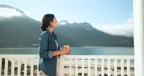 Tranquil moment on balcony overlooking scenic bay