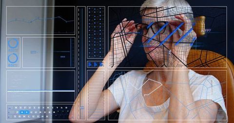 Senior woman adjusting prescription smart glasses viewing augmented reality hud at home