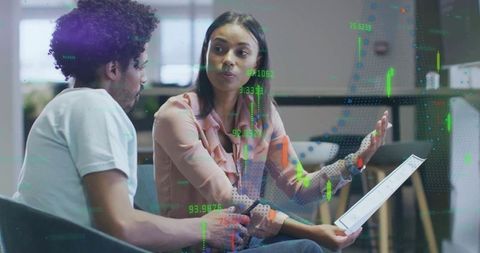 Business Professionals Analyzing Financial Data in Modern Office Workspace