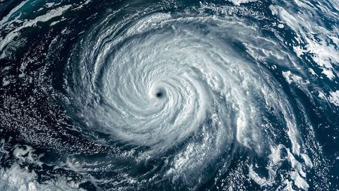Breaking news: dynamic imagery of cyclone vortex over dark blue ocean