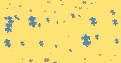 Colorful Puzzle Pieces Cascading on Yellow Backdrop