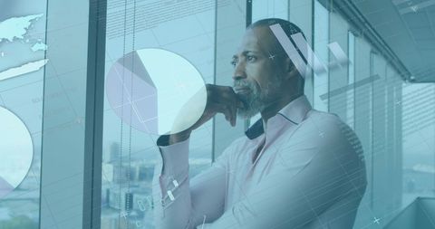 Businessman Contemplating Future with Data Visualizations