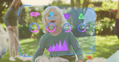 Laughing child playing in sunlit backyard with augmented reality hud and soap bubbles