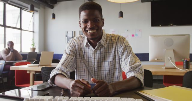 African American businessman smiling in modern office - Download Free Stock Images Pikwizard.com