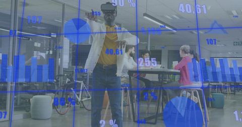 Man wearing vr headset interacting with augmented analytics in open-plan office