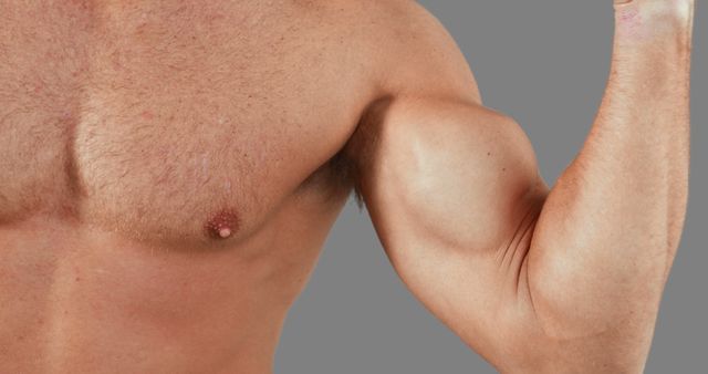 Close-Up of Muscular Man Flexing Bicep - Download Free Stock Images Pikwizard.com