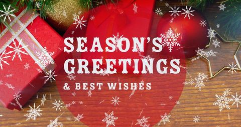 Season's Greetings with Christmas Decorations on Wood Surface