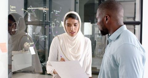 Professional Meeting Collaborating on Strategy in Modern Office