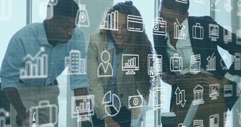 Diverse Team Collaborating in Modern Office with Analytics Overlay