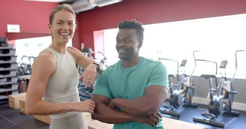 Diverse Fitness Enthusiasts Exhibiting Confidence in Gym Setting