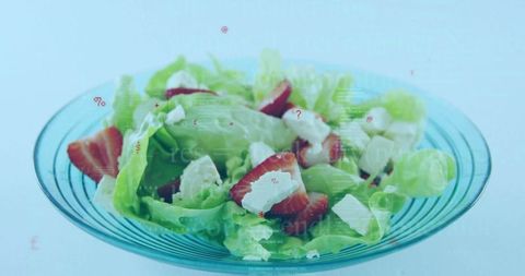 Fresh Strawberry and Cheese Salad with Lettuce in Glass Bowl