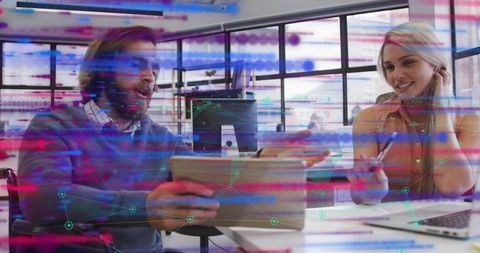 Collaborating Business Professionals Analyzing Digital Data on Devices