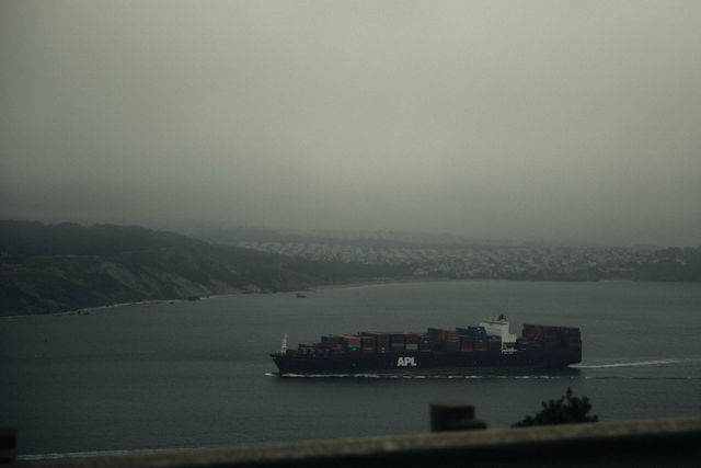 Container Ship Sailing Through Foggy Waters - Download Free Stock Photos Pikwizard.com